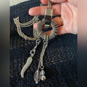 Silver necklace with charms attached